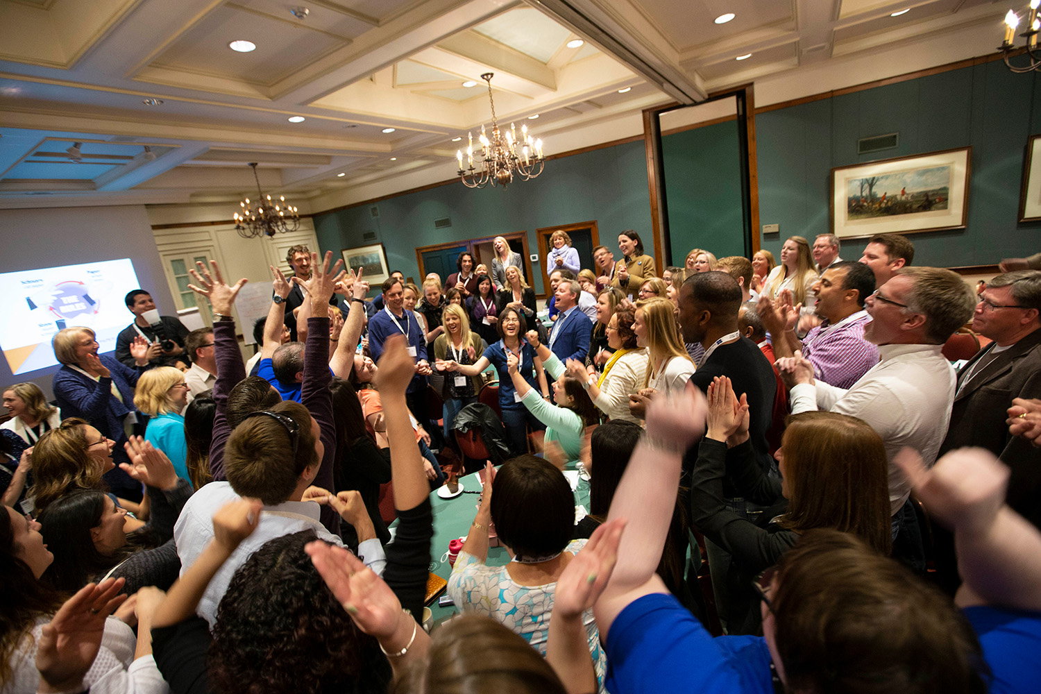 Crowd cheering to a spirited game of Rock Paper Scissors