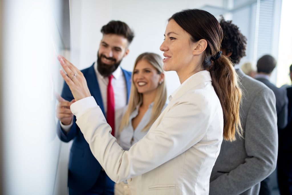 team looking at poster